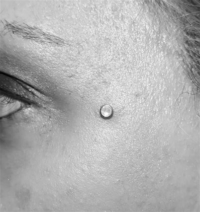 Sternum Cleavage Microdermal Surface Piercing on Collarbones Stock  Photo  Image of macro tattoos 101529456